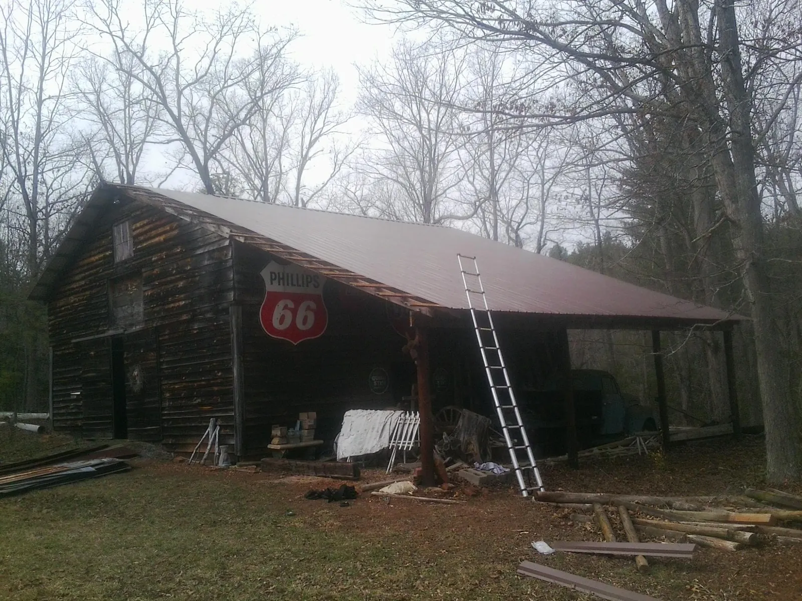 New metal roof on an open sided timber barn with a vintage sign in Egg Harbor City